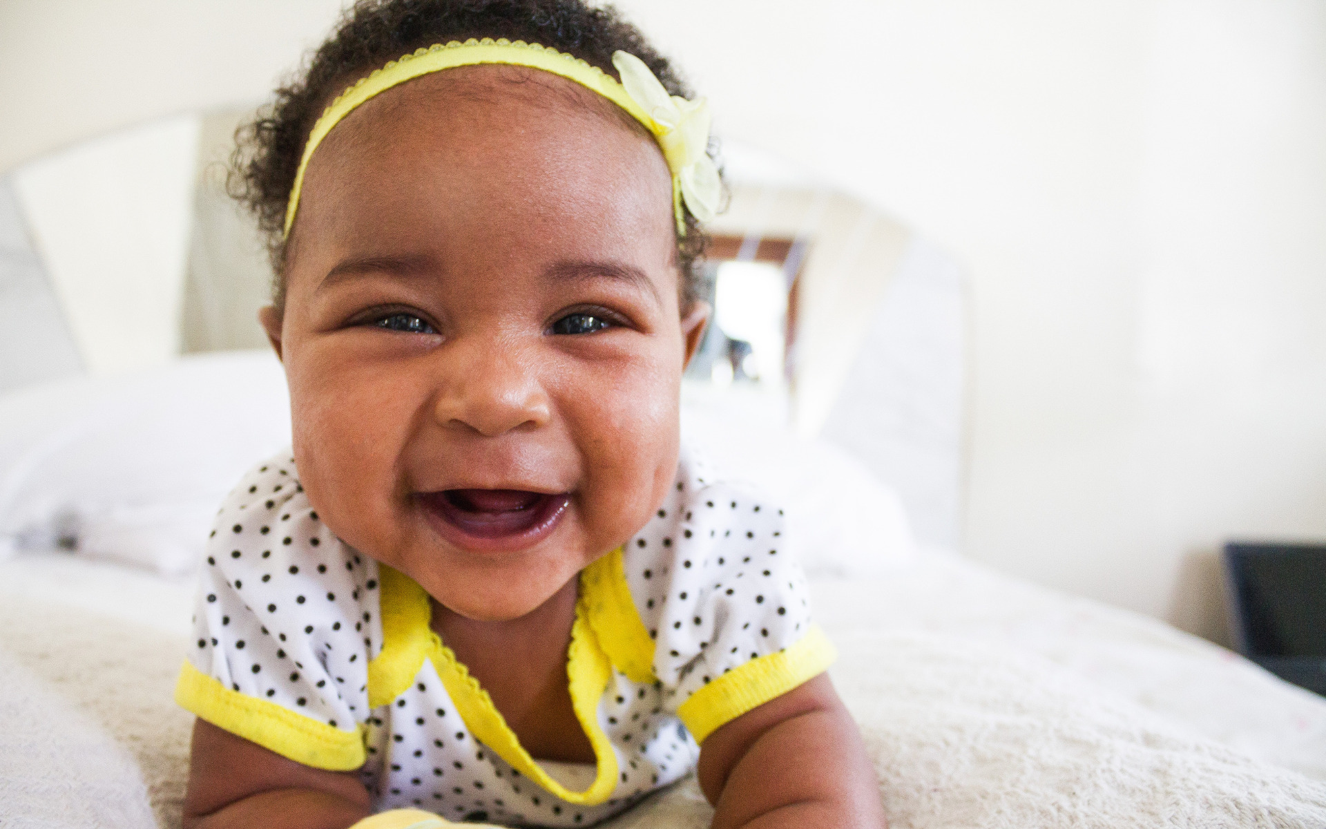 A smiling baby at home in Burtonsville, MD.